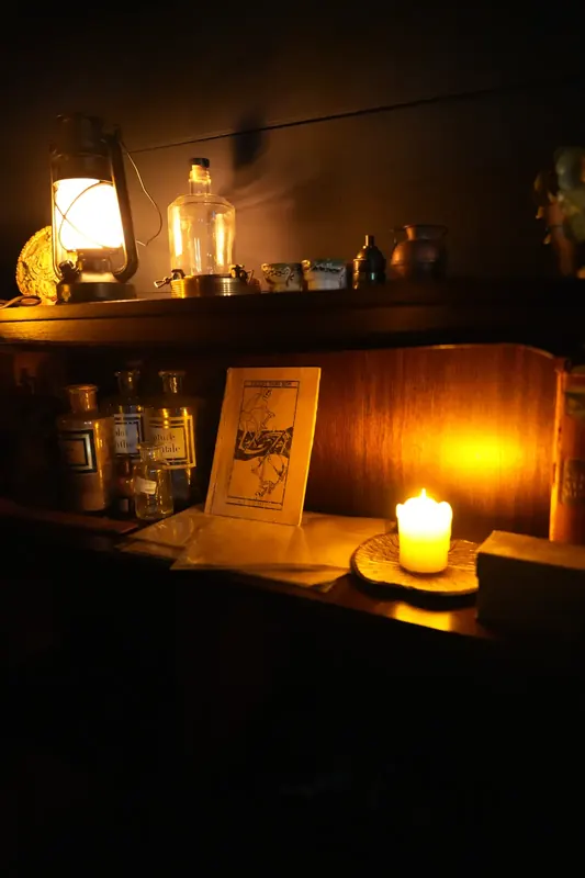 Candlelit apothecary display inside Maelstrom
